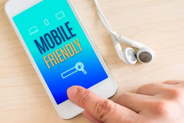 DP Mobile Friendly Phone on Table with Headphones
