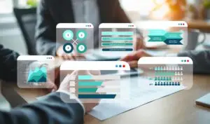Office scene with a blurred background and translucent infographic cards showing charts and diagrams over a tabletop.