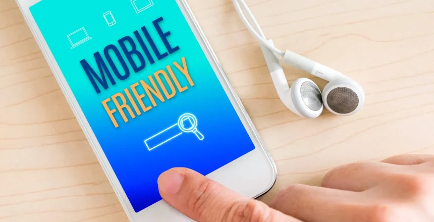 DP Mobile Friendly Phone on Table with Headphones