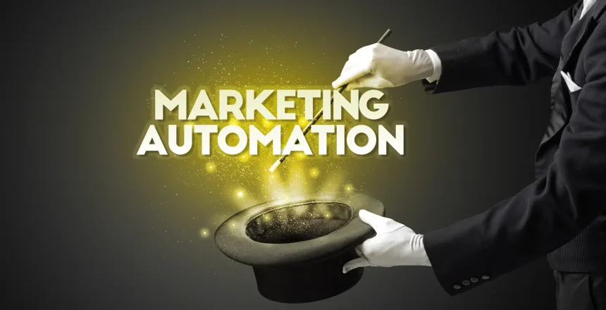 Illusionist is showing magic trick with MARKETING AUTOMATION inscription, new business model concept