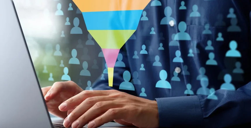 Marketing funnel analysis of customer activity data. Analytics chart of sales conversion rate. Marketer analyzing data with using laptop computer at desk in office.