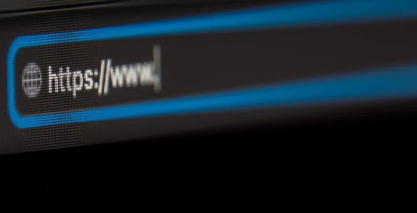 Browser close-up with https. blue frame, black background. LCD screen