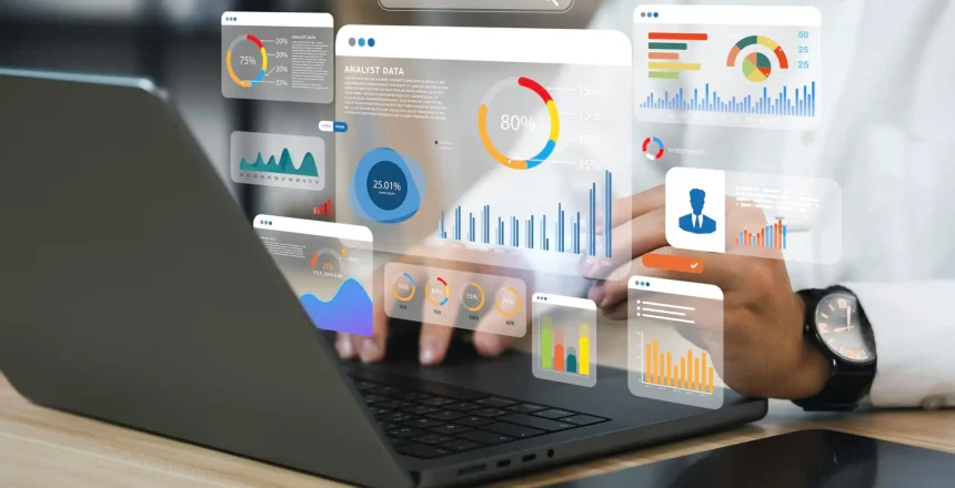 An analyst uses a computer and dashboard for data business analysis and Data Management System with KPI and metrics connected to the database for technology finance, operations, sales, marketing